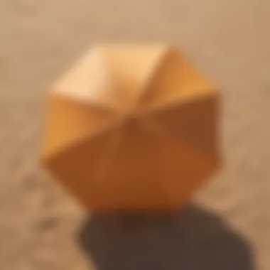 A vibrant beach umbrella providing shade on golden sand