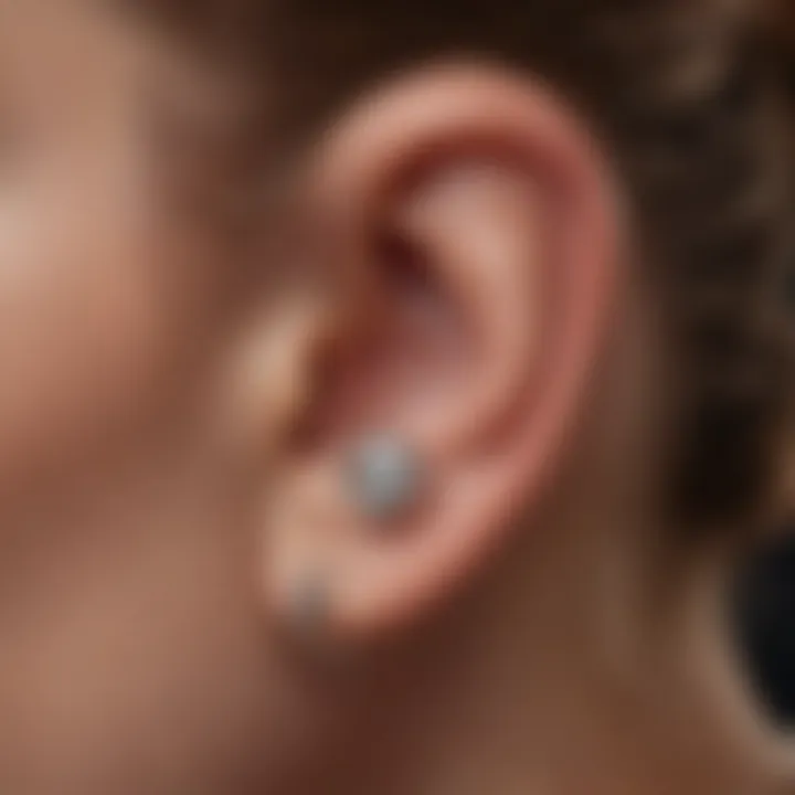 A close-up of a daith piercing in a person's ear