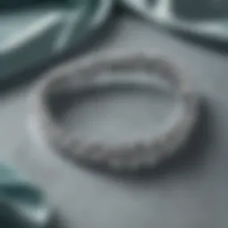Elegant Tiffany and Co. silver bracelet displayed on a luxurious velvet backdrop