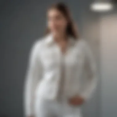 Layering Elegance: White Stretch Denim Jacket over Sweater Layered outfit showcasing a white stretch denim jacket over a sweater