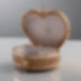 Elegant heart-shaped jewelry box adorned with intricate designs