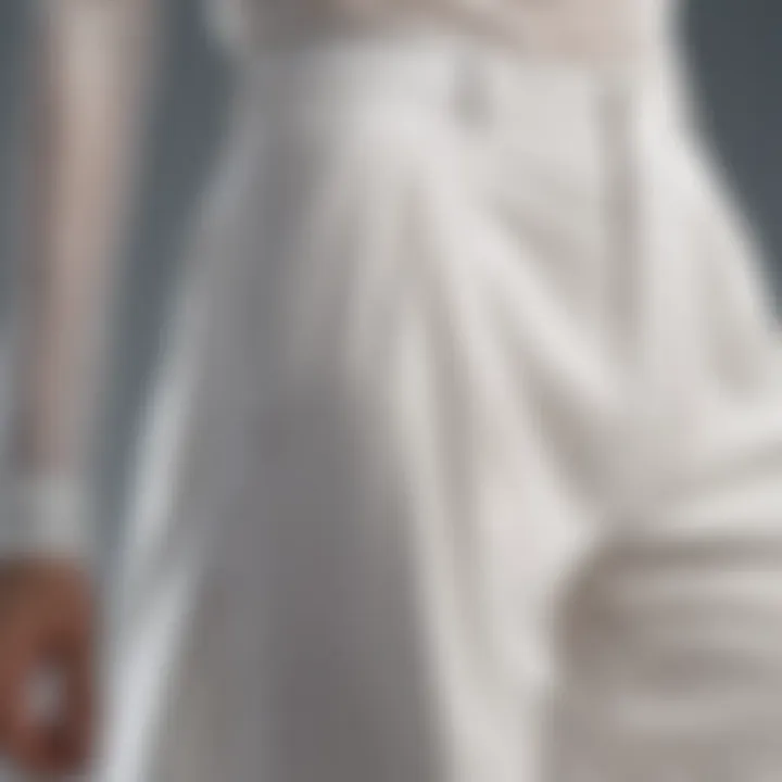 Close-up of the fabric texture of white flowy trousers