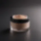 A close-up of a luxurious setting powder container.