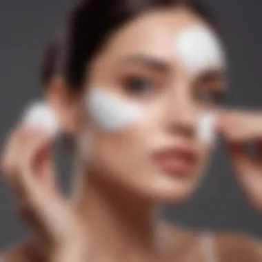 Artful Application of Makeup Remover Woman's hand delicately applying pharmacy makeup remover with cotton pad
