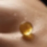 Close-up of vitamin E oil droplets on skin