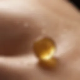 Close-up of vitamin E oil droplets on skin